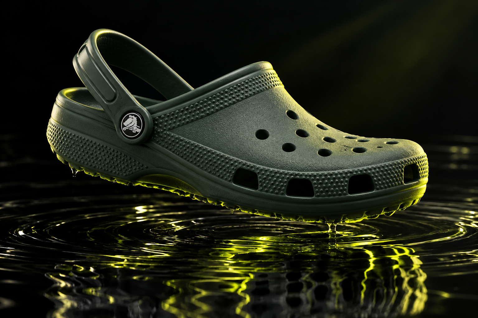 Crocs concept supporting image: Study: a charcoal clog over chartreuse reflections.